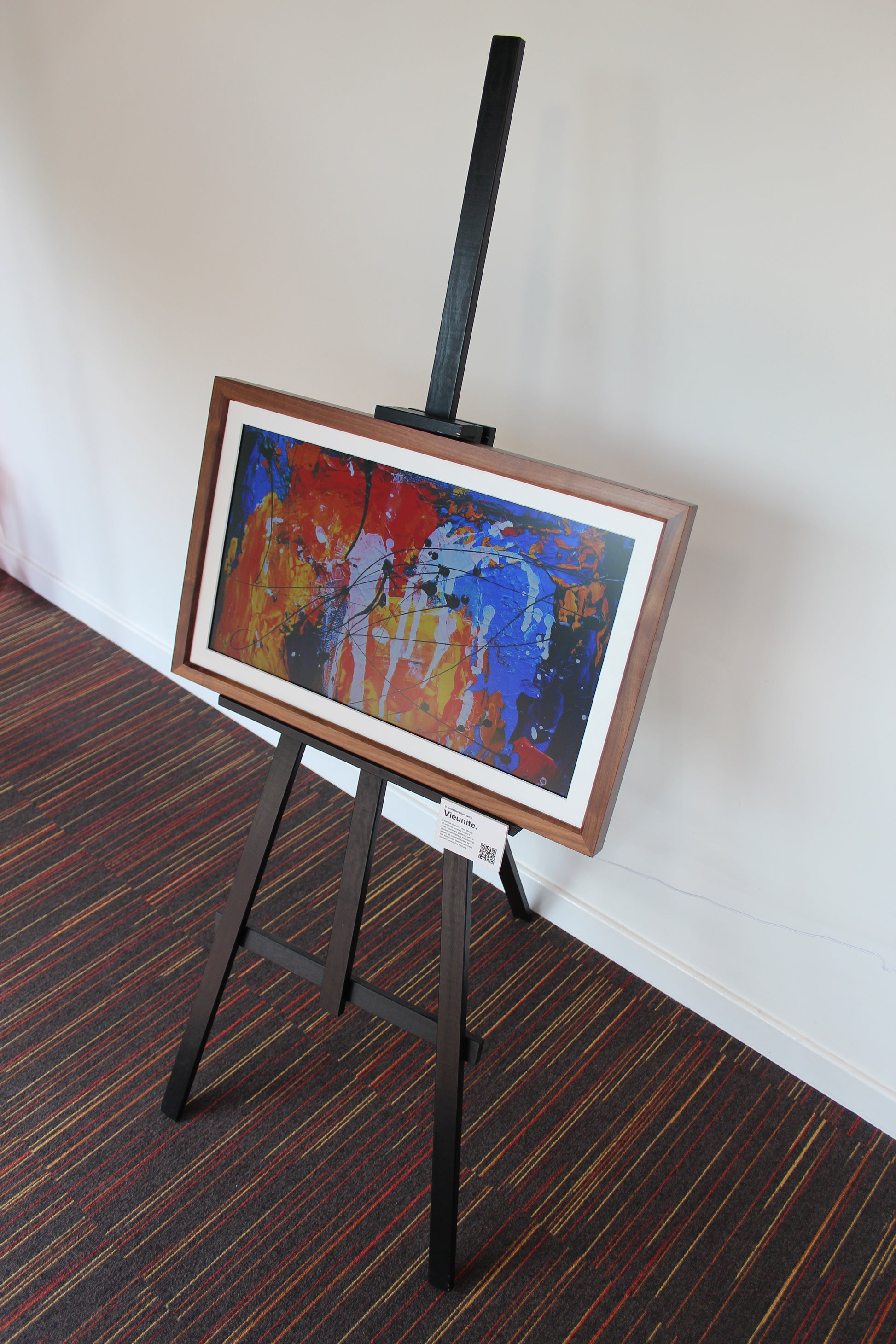 Digital Canvas with Wooden Frame mounted onto a floor standing Easel